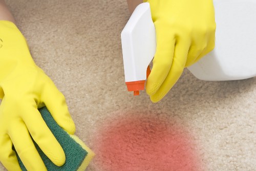 Technician preparing carpet cleaning equipment safely