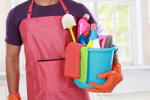 Professional carpet cleaner in Ealing cleaning a living room carpet