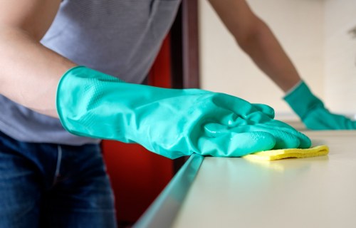 Cleaner in Ealing performing detailed kitchen cleaning
